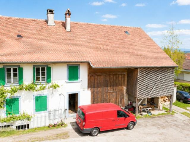FERME FRIBOURGEOISE À FORT POTENTIEL AU COEUR DE DOMDIDIER