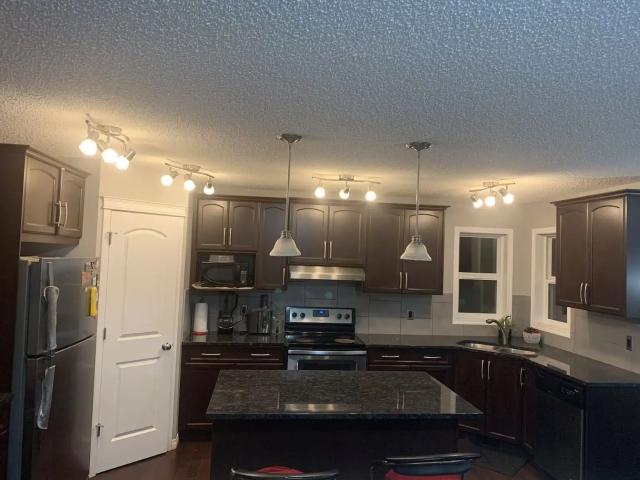 Front garage family living in well maintained, close to all amenities, and bus