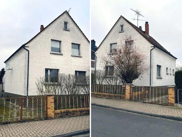 Freistehendes Ein Zweifamilienhaus mit großem Grundstück