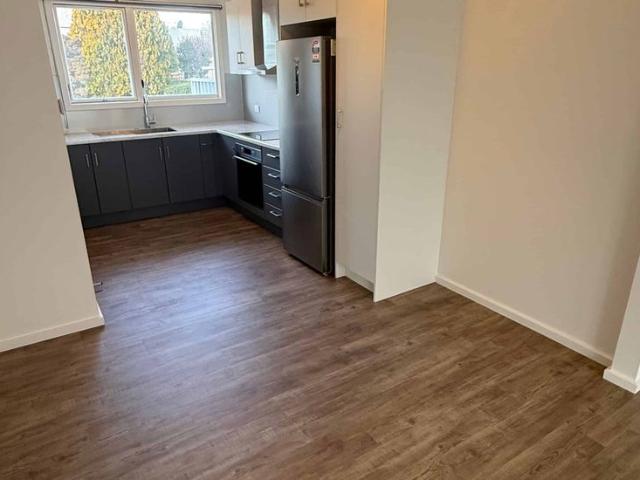 Freshly Renovated Two Bedroom Unit with Sunroom & Garage