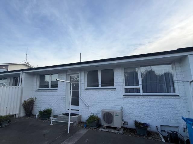 Freshly Renovated Two Bedroom Unit with Sunroom & Garage