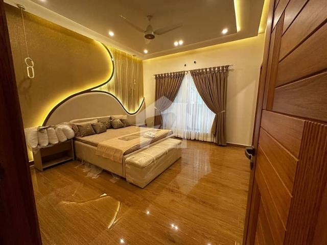 Fully Furnished 10 Marla Designer House Available For Sale Just 1 Minut Drive From The Main Gate!