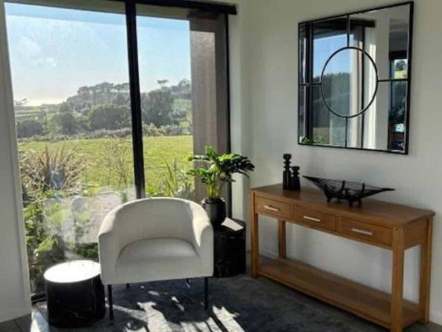 Fully Furnished Architectural Home with Tasman Sea & Mountain Views