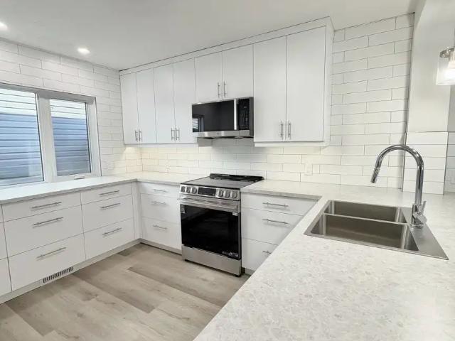 Fully Renovated 4 Bedroom Duplex, Oversized Garage, Sunny Corner Lot