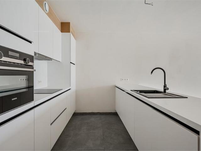 Gelijkvloers appartement met terras en tuin