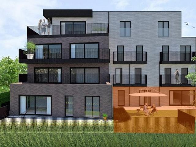 Gelijkvloers tweeslaapkamer appartement op topligging lan.
