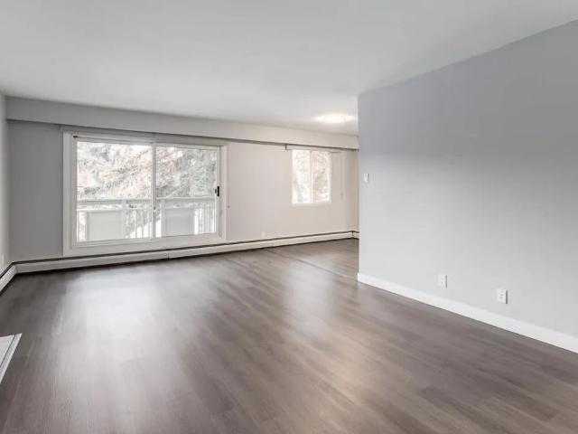 Glenmore Gardens Coach Homes 1 Bedroom Home for Rent at 2105 90 Ave Sw, Calgary, AB T2V 0X5 Palliser