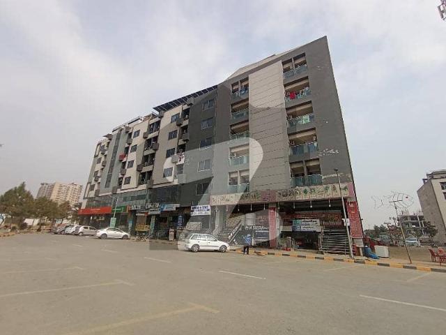 Ground floor shop for sale in faisal town block a main commercial