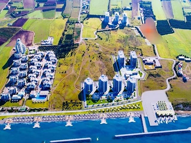 GÜZELYURT SAHİLİNE, SİTE ve PLAJA YÜRÜME MESAFESİNDE imarlı arsa
