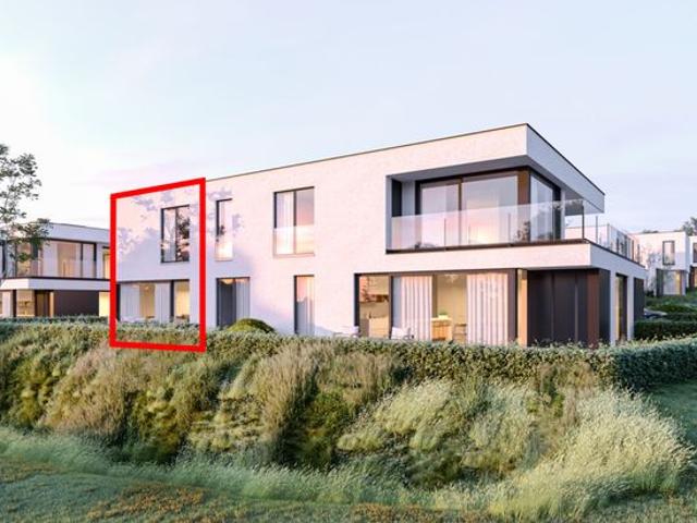 Halfopen woning langs park in Marke