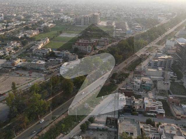 Corner 85 Marla Commercial Plot For Sale On Canal Road Faisalabad Best for Investment