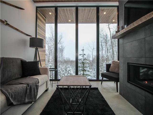 Héméra Chalet moderne avec spa et vue sur le fleuve Équipe de gestion et d'entretien professionnelle
