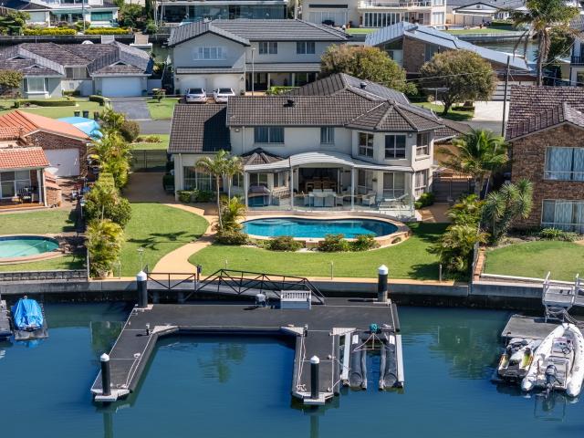 Immaculate turn key deep waterfront home enjoys premier inner circle island position