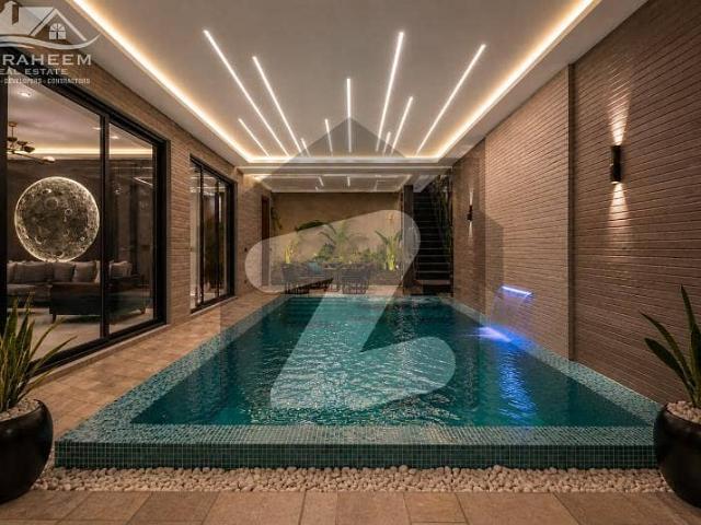 Indoor infinity swimming pool 1 kanal fully furnished ultra modern bungalow for sale in phase 7 near to raya
