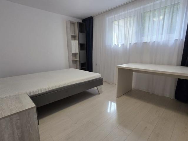 IULIU MOLDOVAN PREMIUM RESIDENCE: a tastefully furnished apartment for rent in Cluj Napoca, featuring two bedrooms and a living room, located a 2 minute walk from the University of Medicine and Pharmacy