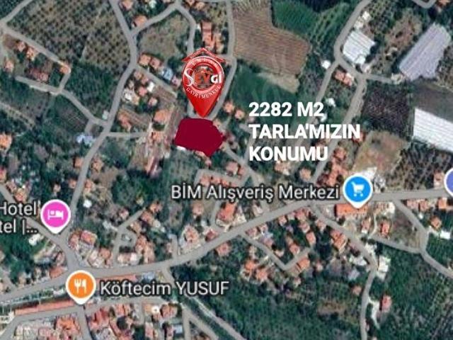 KAŞ GÖMBE'DE KÖY YERLEŞKESİNDE, ARSA VASIFLI, YOLU, SUYU, ELEKTRİĞİ DİBİNDE SATILIK ELMA BAHÇESİ