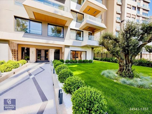 KALAMIŞ'TA YEŞİLLE İÇ İÇE, 724 GÜVENLİKLİ 125m2 3+1 BAHÇE KATI