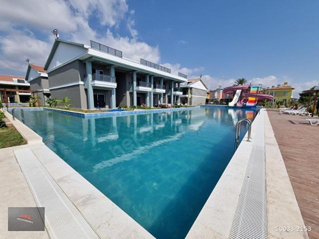 KAPIZLI BAKANLKLAR CAD. SATILIK HAVUZLU BAHÇELİ 1+1 YAZLIK DAİRE