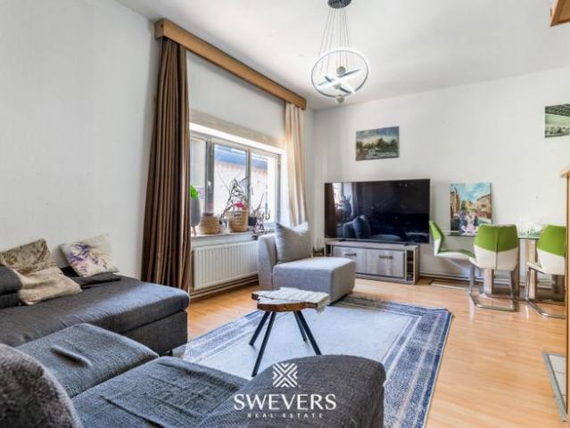 Karaktervol appartement met potentieel op toplocatie te Has