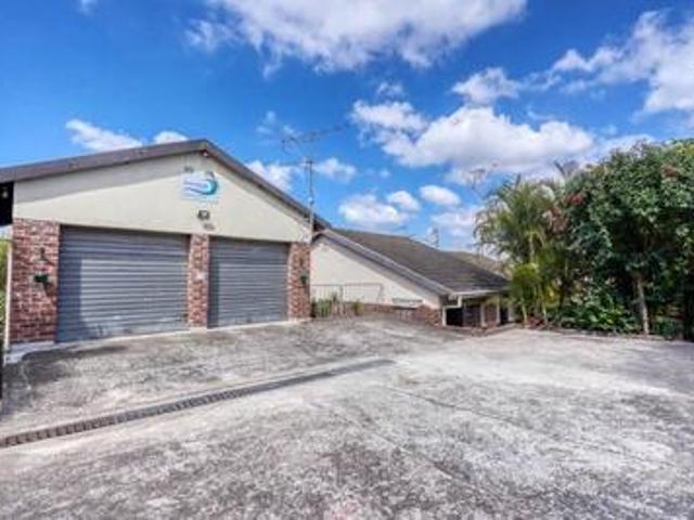 large family home with cottages on.
