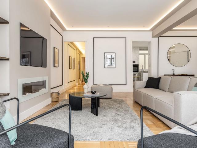 Lavish 3 Bedroom Apartment with Beach Inspired Design and Dedicated Office in Almagro, Madrid Amsterdam Apartments for Rent