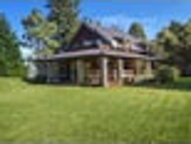 Log home with private river access