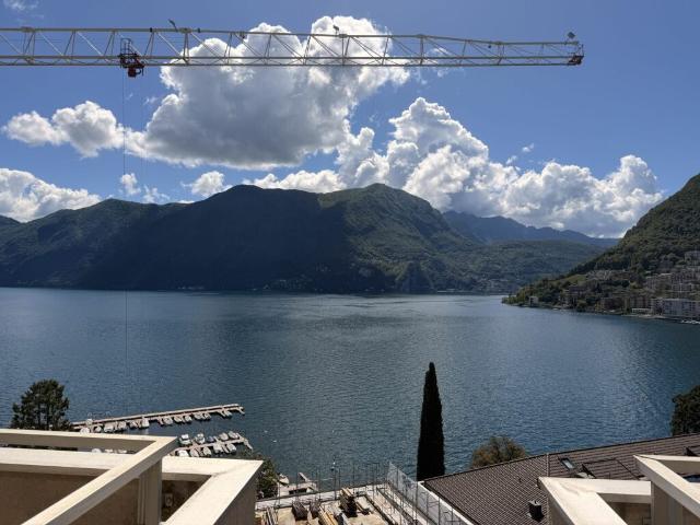 LUGANO SUPER ATTICO DI RAPPRESENTANZA CON VISTA LAGO PISCINA CONDOMINIALE NEL RESIDENCE CENTRAL PARK