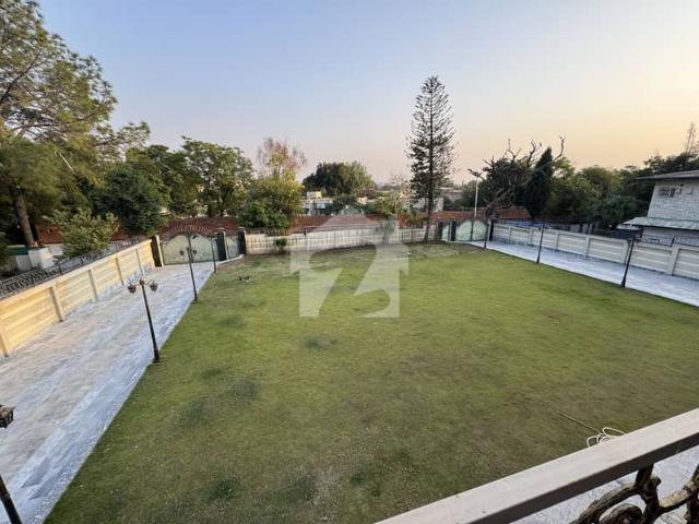Luxurious brand new house beautiful green lawn excellent location modren fitting specious washrooms double kitchen dining drawing 2 tv l beautiful terrace 2 servant quarter