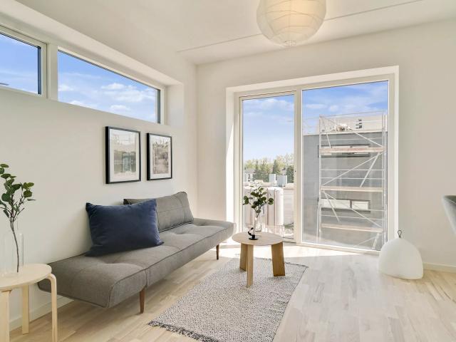 Lys og moderne 2 værelses lejlighed med egen terrasse