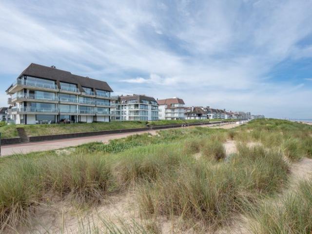 Magnifiek appartement op de wandeldijk in het Zoute, met.