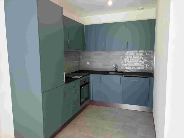 Magnifique appartement de 2.5 pièces au 1er étage d'un immeuble neuf avec balcon