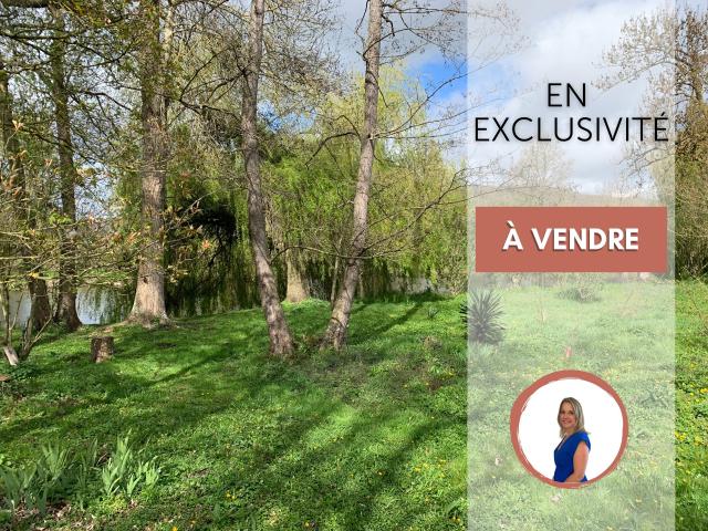 Magnifique terrain de loisirs arboré au bord de l'Eure ! à 2 mn d' Anet