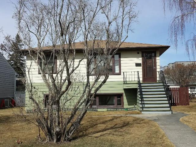 MAIN FLOOR TWO SPACIOUS BEDROOMS BRIGHT RAISED BUNGALOW