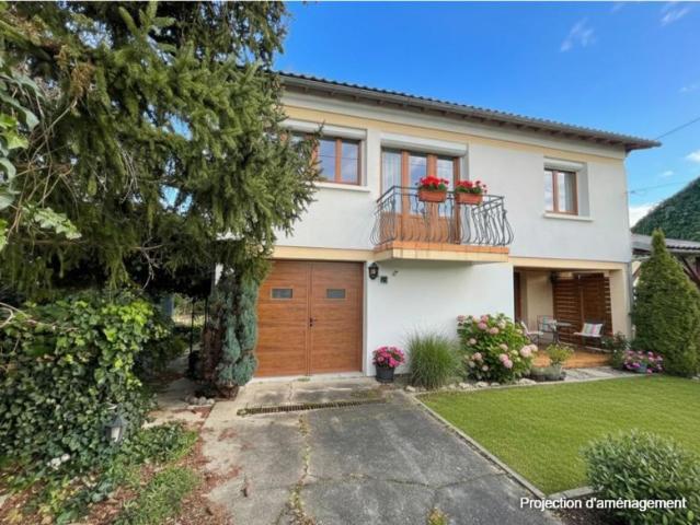 Maison avec jardin, garage et terrain constructible
