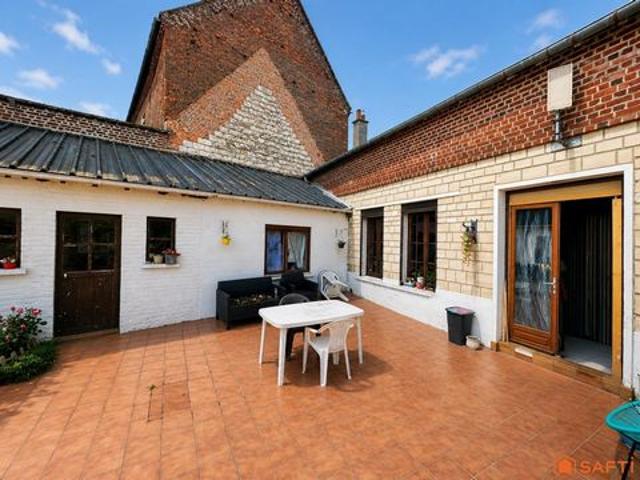 Maison avec jardin et fort potentiel