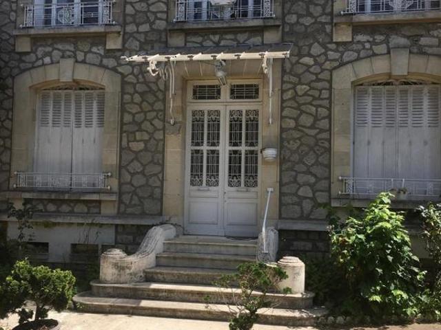 Maison bourgeoise avec jardin au centre ville
