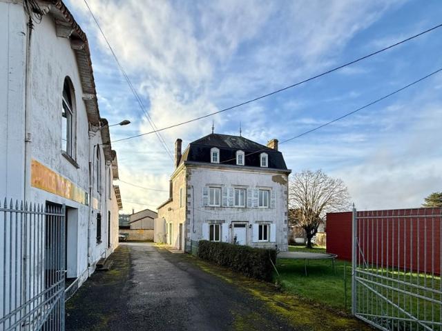 Maison bourgeoise présentant un potentiel commercial