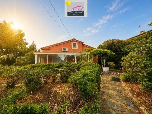 Maison de plain pied avec jardin et double garage