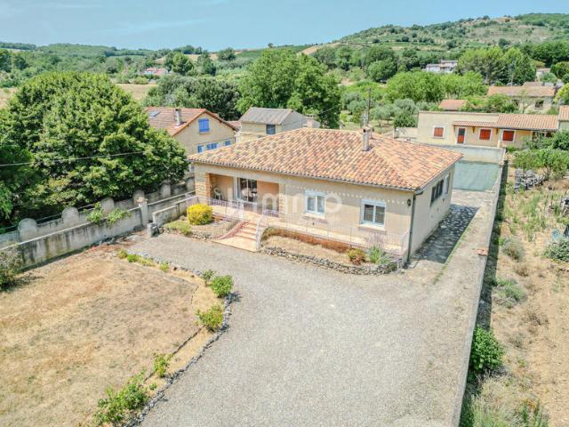 Maison de plain pied avec jardin et grand garage