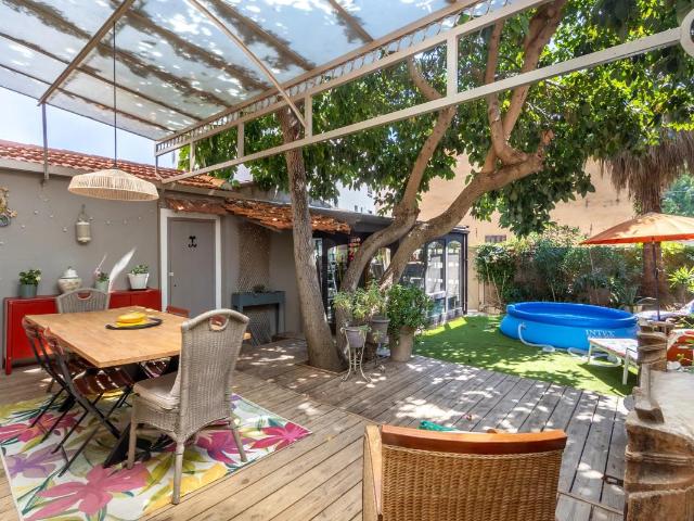 Maison de plain pied de 84,47 m² avec combles aménagés et jardin