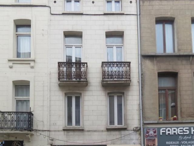 Maison de rapport avec commerce et logement