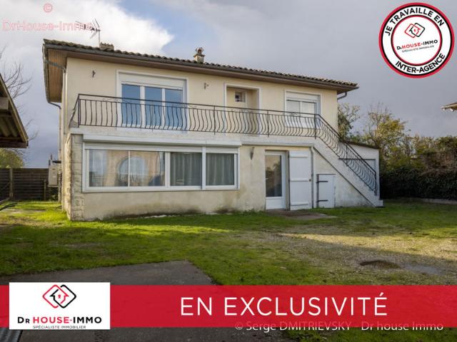 Maison Familiale de 5 Pièces avec Terrasse et Garages à Saint Julien Beychevelle
