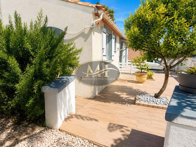 Maison T4 de plain pied avec garage sur terrain arboré de 586 m2