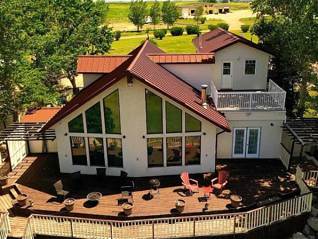Majestic Waterfront Property With 18 hole Golf Course Awaits You