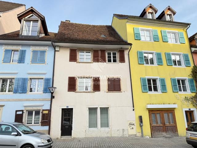 Miethaus mit 2 Wohnungen und 1 Geschäft zum Verkauf in Delémont