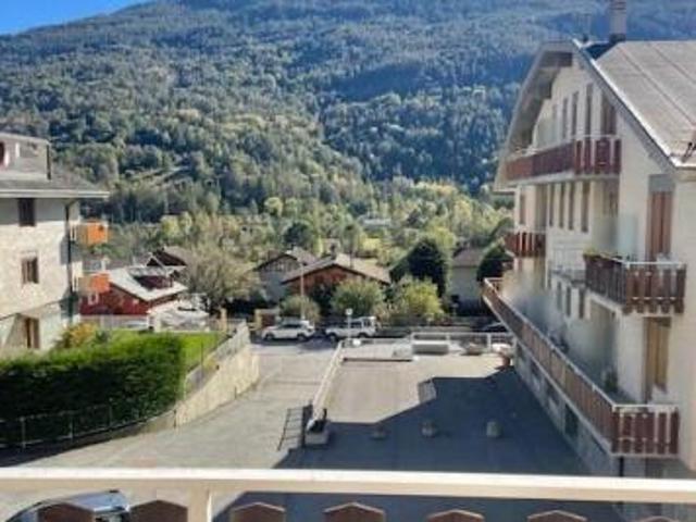 MONOLOCALE CON BALCONE PANORAMICO, POSTO AUTO IN GARAGE CONDOMINIALE, SKI BOX