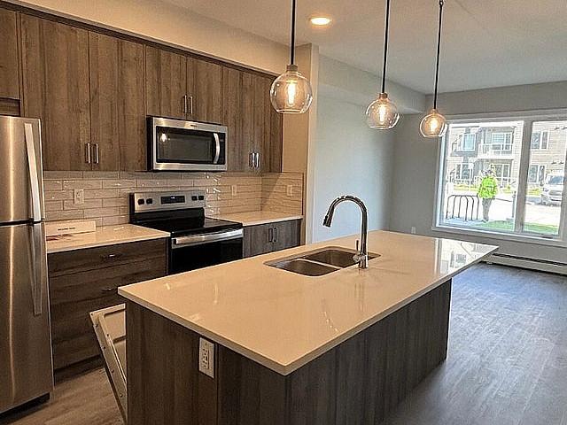 Modern 2 Bed 1 Bath Condo | Heated Ug Parking | Storage |