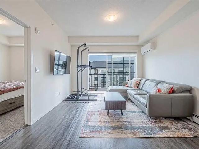Modern 2 bed, 2 bath bright condo, 811 sq ft, oversized balcony & parking