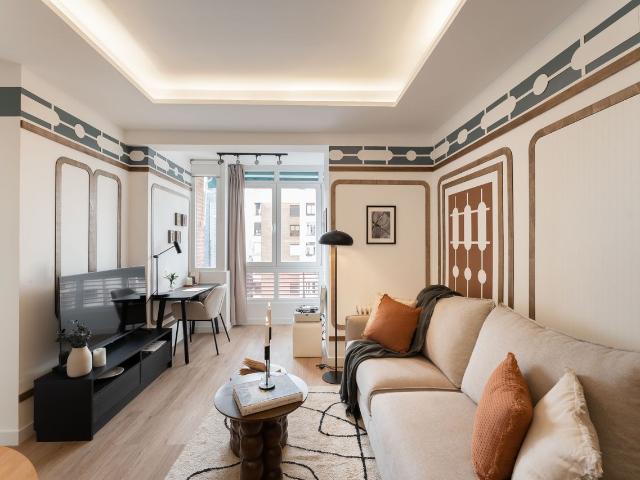 Modern 2 Bedroom Apartment with Designer Decor and Smart Amenities in Orense Street, Madrid Amsterdam Apartments for Rent