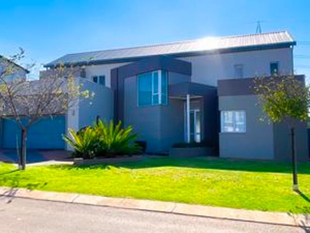 modern 4 bedroom house on a greenbel.